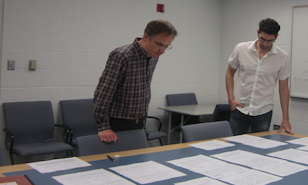 Professor Proga and his PhD student examining spectra.